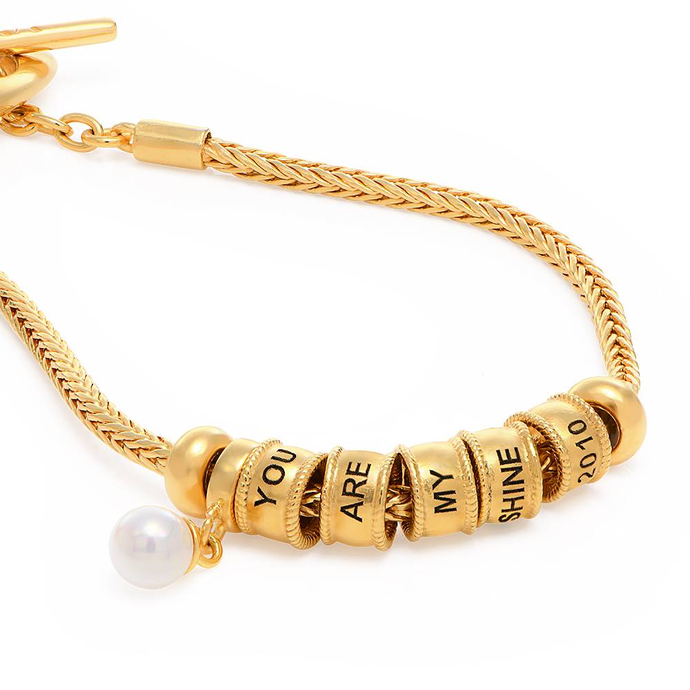 Linda Toggle Heart Charm Bracelet with Pearl in 18K Gold Plating product photo