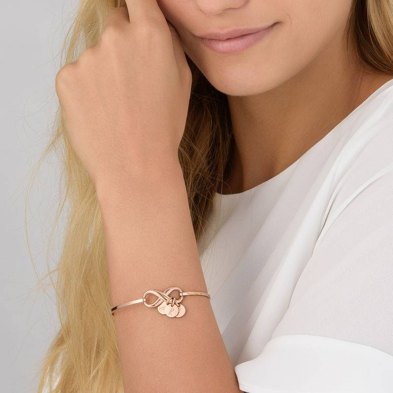 Infinity Bangle Bracelet with Initial Charms in Rose Gold Plating-2 product photo