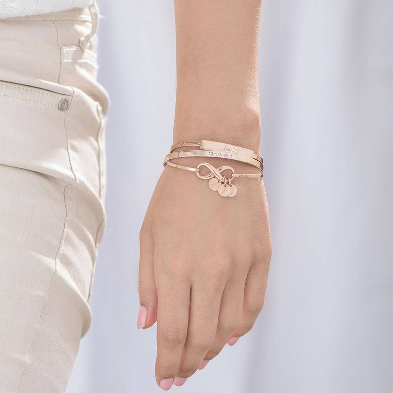 Infinity Bangle Bracelet with Initial Charms in Rose Gold Plating-4 product photo